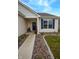 Inviting front entrance with tasteful landscaping and a welcoming door at 932 Sagittarius Ave, Franklin, IN 46131