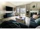 Comfortable living space with fireplace, sofa, and sliding doors to the backyard at 932 Sagittarius Ave, Franklin, IN 46131