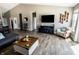 Open-concept living area features stylish decor and large windows for ample natural light at 932 Sagittarius Ave, Franklin, IN 46131