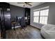 Office features dark built-ins, modern desk, and natural light from the window at 932 Sagittarius Ave, Franklin, IN 46131