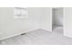 This is a bright bedroom with carpet floors and ample natural light coming from the window at 979 Monroe St, Indianapolis, IN 46229