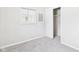 Bedroom featuring neutral tones, a closet, and a window for natural lighting at 979 Monroe St, Indianapolis, IN 46229