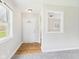 Bright foyer features wood-look floors and a large window for ample natural light at 979 Monroe St, Indianapolis, IN 46229