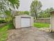 An exterior shot of a detached garage, featuring a sturdy structure and a driveway, providing parking and storage at 979 Monroe St, Indianapolis, IN 46229