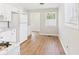Eat-in kitchen features wood-look floors and an abundance of natural light at 979 Monroe St, Indianapolis, IN 46229
