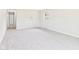 Bright living room with neutral carpeting and walls at 979 Monroe St, Indianapolis, IN 46229