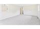 Spacious living room with plush neutral carpeting at 979 Monroe St, Indianapolis, IN 46229