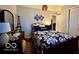 Charming bedroom with a full-size bed, dresser, mirror, and cozy decor at 1018 Redwood Dr, Lebanon, IN 46052