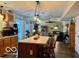 Bright kitchen with wooden cabinets, island, and an open floor plan leading to the living area at 1018 Redwood Dr, Lebanon, IN 46052