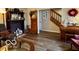 Cozy living room with a fireplace, hardwood floors, and comfortable furnishings at 1018 Redwood Dr, Lebanon, IN 46052