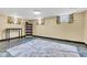 Finished basement with tile flooring, rug, and multiple windows for natural light and a cozy atmosphere at 1029 E Yoke St, Indianapolis, IN 46203