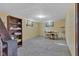 Basement area featuring concrete floors, a dining table, and a storage area at 1029 E Yoke St, Indianapolis, IN 46203