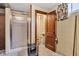 Basement bathroom features a walk-in shower, sink, and open door to utilities at 1029 E Yoke St, Indianapolis, IN 46203