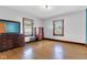 Bedroom with hardwood floors, stained glass windows, and antique furnishings at 1029 E Yoke St, Indianapolis, IN 46203