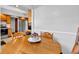 Charming dining area with wood table and seating, adjacent to kitchen, stainless refrigerator at 1029 E Yoke St, Indianapolis, IN 46203
