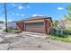 Detached one car brick garage with a single car garage door and driveway approach at 1029 E Yoke St, Indianapolis, IN 46203