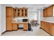 Spacious kitchen features wood cabinetry, a desk area, and an adjacent dining area at 1029 E Yoke St, Indianapolis, IN 46203