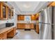 Functional kitchen features warm cabinetry, modern appliances and ample counter space at 1029 E Yoke St, Indianapolis, IN 46203