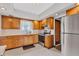 Well-lit kitchen showcasing classic cabinetry, stainless steel appliances and a bright window at 1029 E Yoke St, Indianapolis, IN 46203