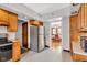 Spacious kitchen offering stainless steel refrigerator and easy access to the dining area at 1029 E Yoke St, Indianapolis, IN 46203