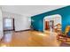 Inviting living room with hardwood floors and a stylish blue accent wall at 1029 E Yoke St, Indianapolis, IN 46203