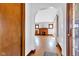 Open living space with hardwood floors, brick fireplace, and an arched doorway at 1029 E Yoke St, Indianapolis, IN 46203