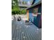Features a back deck with a rocking chair and a grill in a fenced backyard at 1050 Jefferson Ave, Indianapolis, IN 46201