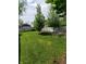Backyard features lush green lawn and landscaping at 1050 Jefferson Ave, Indianapolis, IN 46201