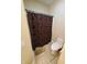 Bathroom with a toilet and a dark shower curtain with light colored circles on it at 1050 Jefferson Ave, Indianapolis, IN 46201