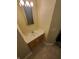 Bathroom with a single sink vanity, mirror, and tile flooring at 1050 Jefferson Ave, Indianapolis, IN 46201