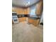 Well-lit kitchen with essential appliances and cabinetry, creating a practical cooking environment at 1050 Jefferson Ave, Indianapolis, IN 46201