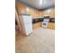 Kitchen showcases cabinetry, white appliances, and tile floors offering a functional cooking space at 1050 Jefferson Ave, Indianapolis, IN 46201