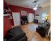 Bright living room features a cozy seating area, hardwood floors, and a television, perfect for relaxing at 1050 Jefferson Ave, Indianapolis, IN 46201