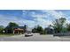 Street view with a car passing in front of Kan-Kan Cinema at 1050 Jefferson Ave, Indianapolis, IN 46201