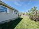 Well-maintained backyard featuring a lush lawn and privacy fence at 106 Walnut St, Southport, IN 46227