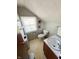 Cozy bathroom featuring a pedestal sink, toilet, and window at 106 Walnut St, Southport, IN 46227