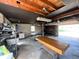 A well-lit garage interior featuring block walls, workbench, and a ping pong table at 106 Walnut St, Southport, IN 46227