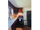 Cozy kitchen features stainless steel appliances, dark cabinets, and abundant counter space at 106 Walnut St, Southport, IN 46227