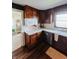 Functional kitchen featuring wood cabinets, stainless steel appliances, and an open layout, ideal for everyday cooking and entertaining at 106 Walnut St, Southport, IN 46227