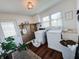 Bright laundry room equipped with modern washer and dryer, complemented by natural light and stylish accents at 106 Walnut St, Southport, IN 46227