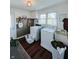 Well-lit laundry room featuring modern appliances, a laundry sink, and practical storage solutions at 106 Walnut St, Southport, IN 46227
