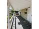 Charming covered front porch with a swing and decorative columns at 106 Walnut St, Southport, IN 46227