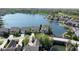 Beautiful aerial view of waterfront homes in a lakeside community, with mature trees and landscaping at 11484 Lake Stonebridge Ln, Fishers, IN 46037
