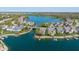 An aerial of homes surrounding a lake with private boat docks and lush trees at 11484 Lake Stonebridge Ln, Fishers, IN 46037