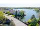Aerial view overlooking a serene lake and beautiful waterfront homes in a picturesque community at 11484 Lake Stonebridge Ln, Fishers, IN 46037