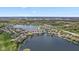 Aerial view of lakeside neighborhood in Fishers District with water views and lush green landscaping at 11484 Lake Stonebridge Ln, Fishers, IN 46037