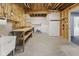 Unfinished basement with shelving, workshop area, and full-sized utility sink at 11484 Lake Stonebridge Ln, Fishers, IN 46037