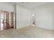 Spacious bedroom with neutral carpet, ensuite bathroom, ample natural light and a door leading to another room at 11484 Lake Stonebridge Ln, Fishers, IN 46037