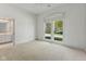Bright bedroom boasts a large window with natural light and views of a beautiful tree lined street at 11484 Lake Stonebridge Ln, Fishers, IN 46037