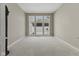 Bright bedroom filled with natural light and with an expansive window offering scenic outdoor views at 11484 Lake Stonebridge Ln, Fishers, IN 46037